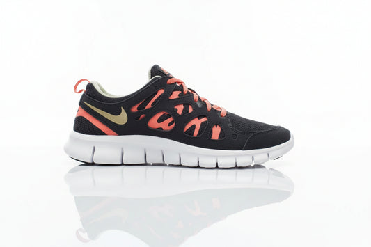 A Nike Free Run 2 sneaker in black with vibrant coral-red accents,